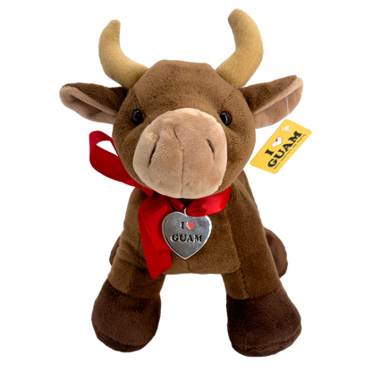 Front view of a brown plush carabao toy with a red ribbon and a heart-shaped ‘I ❤️ GUAM’ tag, featuring an ‘I ❤️ GUAM’ yellow label tag attached to the ear.